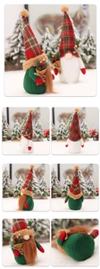 Detailed views of standing Christmas gnomes with plaid hats and festive berry bouquets