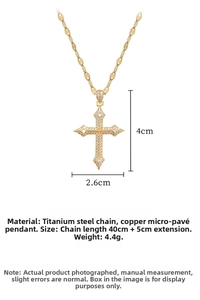 Macro view of gold cross pendant with cubic zirconia and steel chain measurements