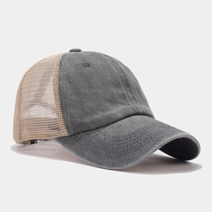 Detail of vintage washed canvas front and breathable khaki mesh back on baseball cap