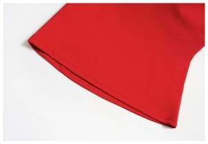Detail of double-needle stitching on red yoga tank top with high-density knit fabric
