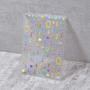 Detail of 5D embossed nail stickers featuring macaron symbols and cute colorful lines