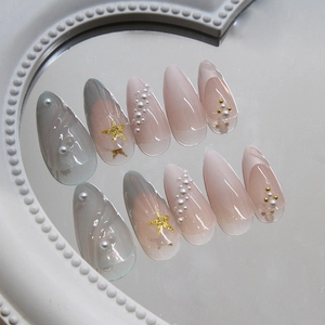 Mermaid seashell press-on nails with 3D pearls and gold stars in long almond shape