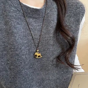 Elegant rocking horse pendant necklace with zircon and tiger eye stone in vintage style