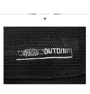 Close-up of breathable black mesh fabric and white OUTDOOR embroidery on the baseball cap