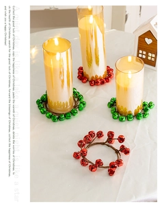 Detail of Christmas bell wreath decoration used as a festive candle holder base