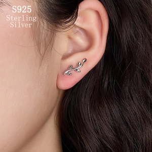Minimalist S925 sterling silver leaf ear cuff earring worn by a model on cartilage