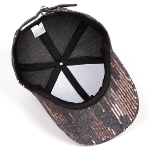 Detail view of cotton baseball cap interior featuring adjustable strap and sequin accents
