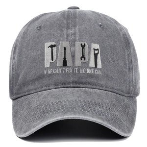 Macro detail of the PAPA letter embroidery and tool graphics on the washed cotton cap