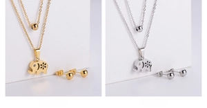 Detail view of hollow elephant pendant with sparkling rhinestone eye in gold and silver finish