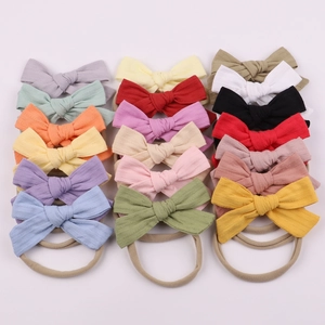 Set of 20 soft elastic nylon headbands with floral fabric bows in various colors