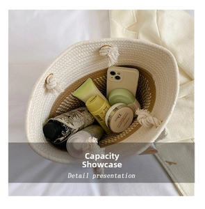 Spacious interior of beige woven tote bag showing daily essentials and capacity details