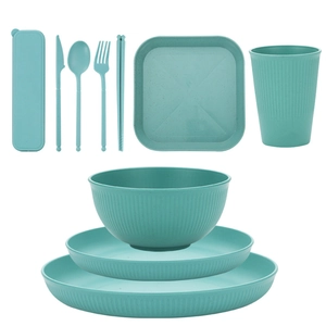 Green wheat straw tableware set with plates, bowls, cups and cutlery for camping