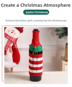 Knitted Christmas wine bottle cover with red green stripes and tiny golden bells