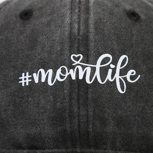 Faded black vintage baseball cap featuring white #momlife embroidery and heart detail