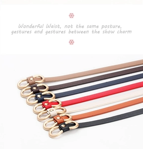 Detail of slim PU leather belts with gold figure-eight buckles in seven various colors