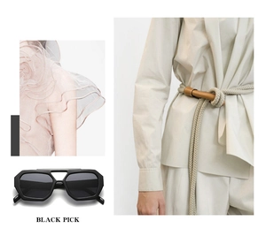 Detail of black geometric sunglasses with beige braided belt and pink layered ruffles