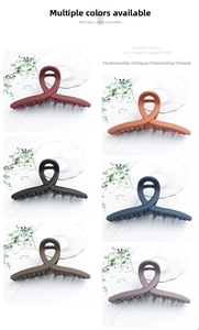 Detail view of large matte hair claws in six colors including red, black and blue
