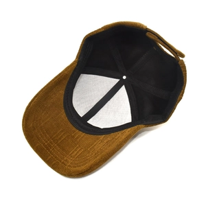 Inside view of brown corduroy baseball cap showing sweatband and lining details