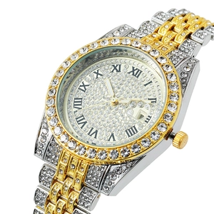 Macro view of crystal-encrusted roman dial with date window on bicolor luxury watch