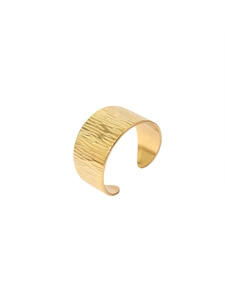 Detailed view of wide 18k gold plated cuff bangle with irregular ripple textured finish