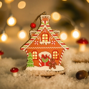 Close-up of wooden gingerbread house Christmas ornament with LED light and festive details