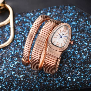 Close-up of rose gold snake bracelet watch featuring a diamond-encrusted bezel and radiant dial