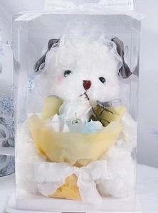 Detailed view of a white plush puppy gift box with rose bouquet and elegant lace veil