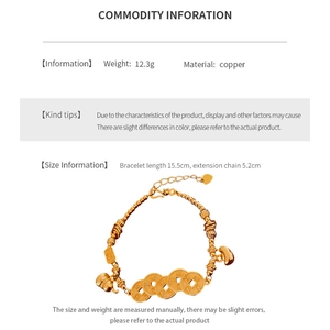 Detail view of gold beaded bracelet with traditional Chinese coin charms and size parameters
