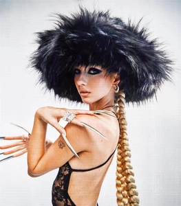 Close-up of thick black faux fur hat texture with a fluffy punk style aesthetic