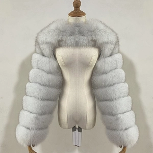Detail of light gray faux fox fur bolero jacket with thick tiered horizontal stitching