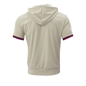 Detail view of the waffle texture and red-blue plaid trim on cream short sleeve hoodie