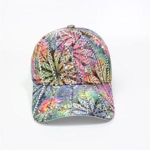 Detail of colorful floral baseball cap with silver star rivets and metallic studs