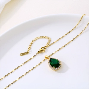 Golden stainless steel necklace featuring a teardrop emerald green zircon pendant