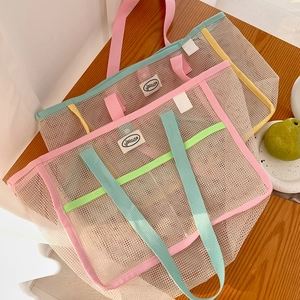 Close-up of mesh tote bags with colorful contrast webbing and hisocute logo label