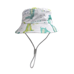 Detail of white cotton bucket hat featuring green crocodile print and adjustable chin strap