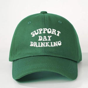 Detailed embroidery of SUPPORT DAY DRINKING text on green cotton twill baseball cap