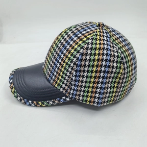 Fashionable baseball cap with colorful houndstooth pattern and black leather brim