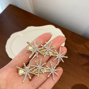 French luxury gold hair clip with sparkling rhinestone star flowers for elegant women