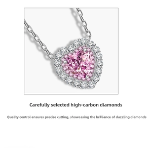 Close-up of pink heart-shaped carbon diamond pendant necklace in 925 silver setting
