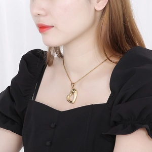 Elegant gold hollow heart pendant necklace with rhinestones on a stainless steel chain