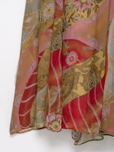 Detail of bohemian floral print midi dress showing lightweight fabric texture and drape