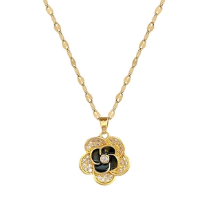 Titanium steel camellia pendant necklace with black enamel and zircons on white background