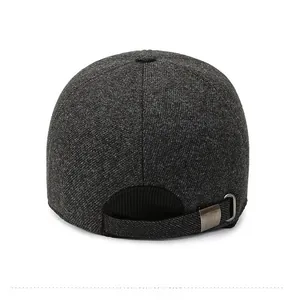 Detail view of the back of a men's winter baseball cap with adjustable metal buckle strap