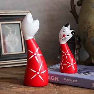 Artistic red wooden cat figurines with star patterns for home decor set of two
