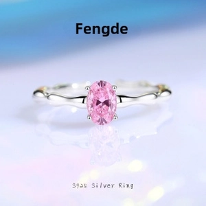 Macro shot of S925 silver bamboo-style ring with oval pink gemstone in 4-prong setting