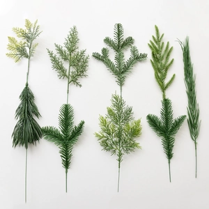 Artificial Christmas pine branches green cedar leaves for DIY wreaths and tree decoration.