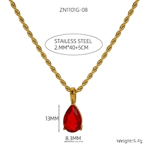 Detail view of 18K gold plated stainless steel necklace with red teardrop stone pendant