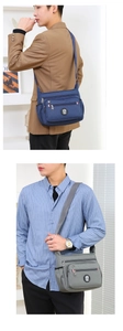 Detail of adjustable straps and zipper pockets on blue and grey nylon crossbody bags