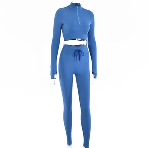 Blue ribbed knit two-piece set with half-zip top and drawstring high-waist leggings