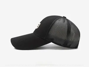 Detailed side view of black breathable mesh baseball cap with white embroidered letter B